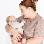 Mum cuddling her baby in the brown and white striped Mackenzie breastfeeding tee by Milky Threads Co