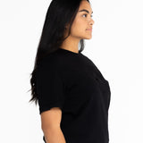 Side view of the black Indiana boyfriend tee showing the relaxed oversized fit