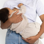Mum breastfeeding her baby in the light grey Indiana breastfeeding tee by Milky Threads Co, worn with jeans