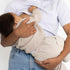 Mum breastfeeding her baby in the light grey Indiana breastfeeding tee by Milky Threads Co, worn with jeans