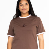 Front view of the Indiana breastfeeding tee in brown with soft pink trim, worn oversized