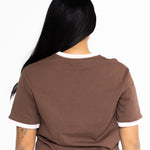 Back of the brown Indiana boyfriend tee, showing the pink trim and relaxed fit
