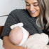 Smiling mum breastfeeding her baby in the black and white striped Mackenzie breastfeeding tee by Milky Threads Co